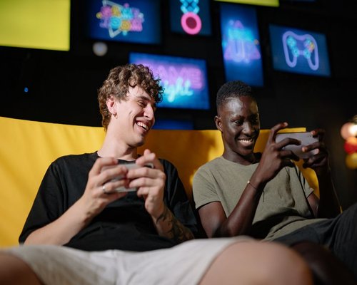 Angled smartphone displaying the fictional Harbour Neon Dash game